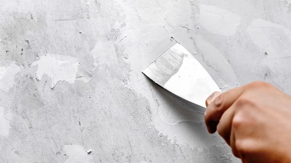 Masilla elástica de Sopgal aplicada con espátula